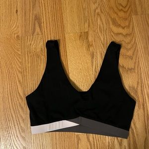 Black sports bra with gray/purple band